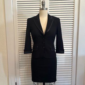BEBE 2 PC BLACK SKIRT SUIT. SATIN TRIMMED W RUFFLE DETAIL. SIZE 2/4. Y2K!